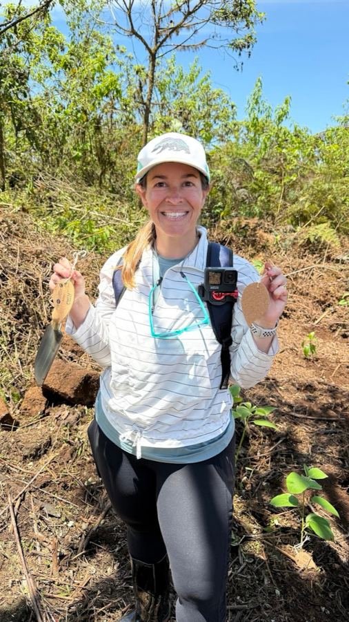 Cassie helping plant native trees during a Galapagos conservation hike